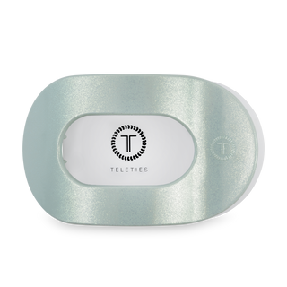 TELETIES flat round hair clip in translucent mint green with brand logo on white label