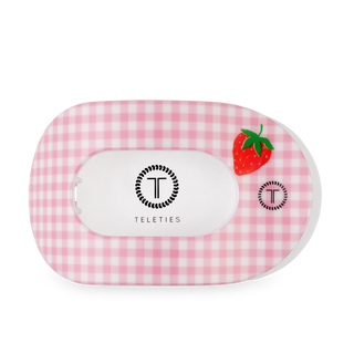 TELETIES flat round hair clip with pink gingham pattern and strawberry design on transparent background