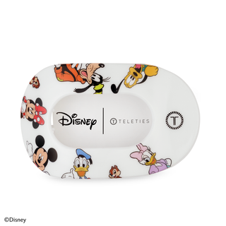 White oval hair clip decorated with colorful Disney Mickey Mouse and friends character illustrations.