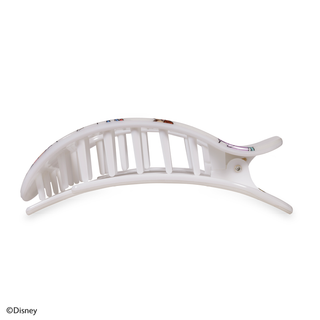 Large flat round hair clip with curved design and decorative teeth pattern on white background
