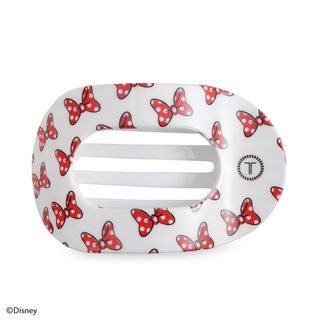 White hair clip with red polka dot bow pattern, oval shape with center slots