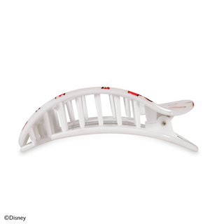 Large flat round hair clip with curved design and tooth grip pattern in translucent material