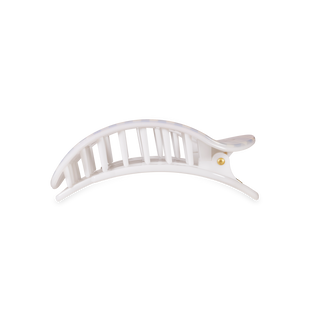 White curved hair clip with ribbed design and black accent details on white background