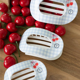 TELETIES flat round hair clips with cherry pattern and polka dot design scattered among fresh red cherries