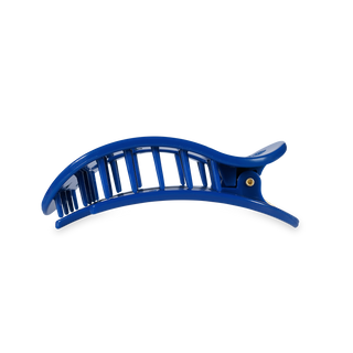 Blue curved hair clip with open slat design and metal rivet closure