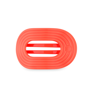 Orange flat round hair tie with ridged texture and oval opening in center