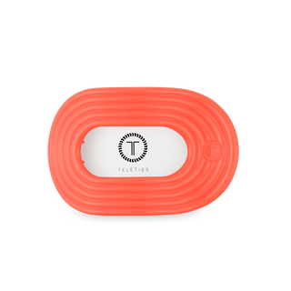 TELETIES flat round hair tie in coral color with brand logo on clear packaging