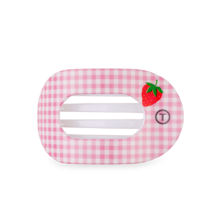 Pink gingham patterned toaster with strawberry decoration and black base on white background.