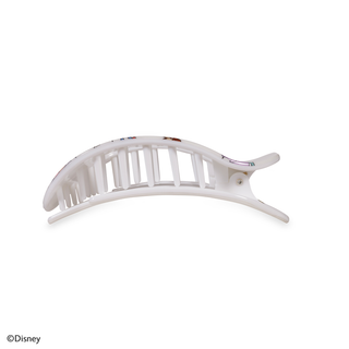 White curved hair clip with vertical slats and decorative pattern on a clean background