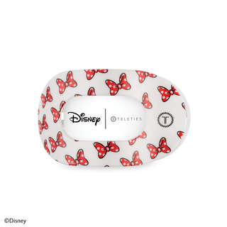 White hair clip case with red polka dot bow pattern, featuring Disney and TELETIES branding.