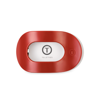 TELETIES flat round hair clip with oval opening and brand logo on white background