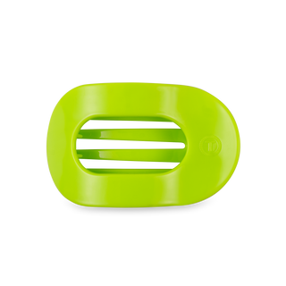 Bright green flat round hair clip with ridged interior grip surface