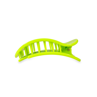 Bright green curved hair clip with ventilated slotted design and hinged clasp mechanism