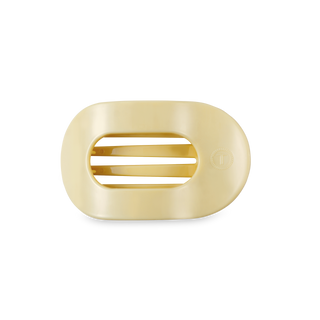 Small flat round hair clip with oval opening and ridged interior grip mechanism