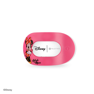 Pink Minnie Mouse flat round hair clip with Disney branding and character illustration