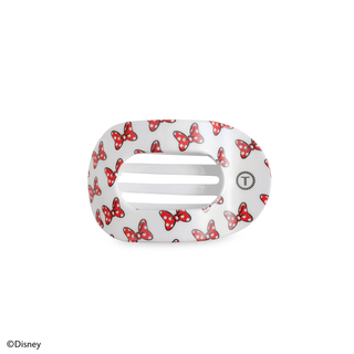 White oval hair clip with red polka dot bow pattern and ventilation slots