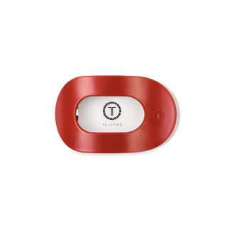 Red oval-shaped flat hair clip with white center displaying TELETIES logo and branding