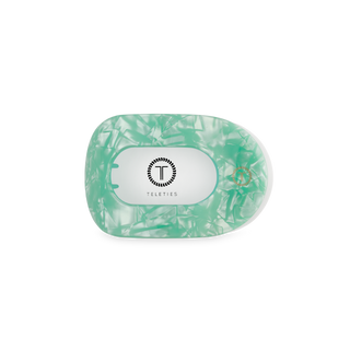 TELETIES flat round hair clip in translucent green with marble pattern and brand logo