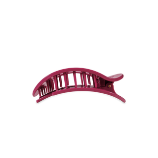 Pink curved hair clip with vertical teeth and secure grip design
