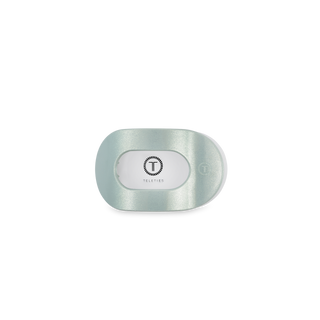 TELETIES flat round hair clip in translucent packaging on white background