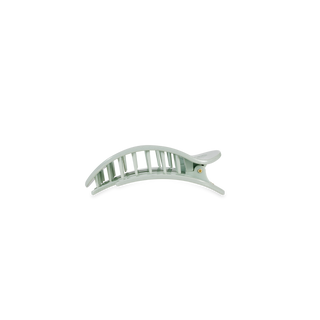 Clear transparent hair clip with vertical ridged design and black elastic band