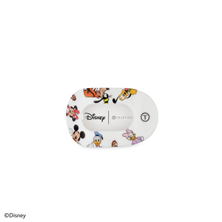 White oval hair clip featuring colorful Disney Mickey Mouse and friends character illustrations