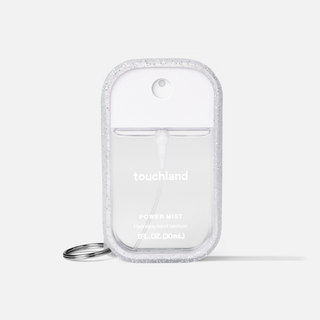 Touchland Power Mist hand sanitizer in a glittery clear case with keyring attachment.