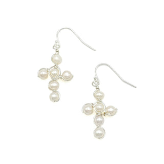 Handcrafted silver wire cross earrings adorned with white freshwater pearls on French hook wires.