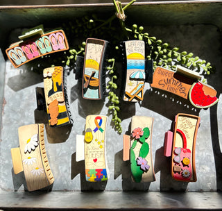 Colorful handmade large hair clips with various painted designs including flowers, summer themes, and decorative patterns ...