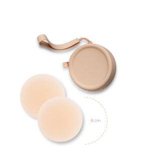Boobeez Headlight Hiders with silicone case showing circular pads and protective carrying case with strap