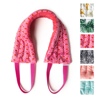 Pink patterned heated neck wrap with adjustable straps and fabric pattern options displayed alongside