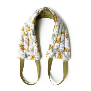Heated neck wrap with tropical leopard and palm leaf pattern, featuring adjustable green straps