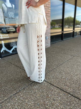 Allie Rose wide-leg linen pants featuring an elegant vertical lace trim detail on the side seam.
