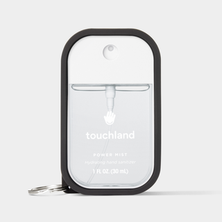 Touchland Power Mist hand sanitizer in a sleek silicone case with keyring attachment.