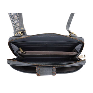Open crossbody wallet showing interior compartments, card slots, and decorative wrist strap with boho pattern.