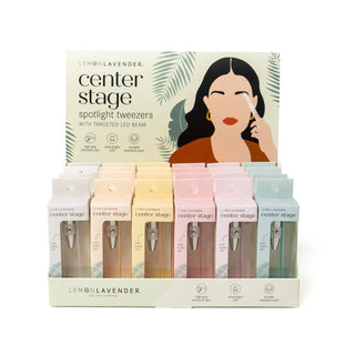 Display of Lemon Lavender center stage spotlight tweezers with LED lights in colorful packaging