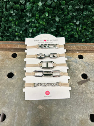 Set of five chain-link hair tie bracelets with silver metal accents on white packaging card.