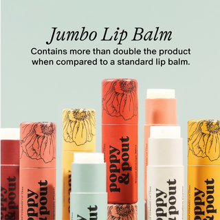 Various colorful Poppy & Pout jumbo lip balm tubes with floral designs displayed against light background.