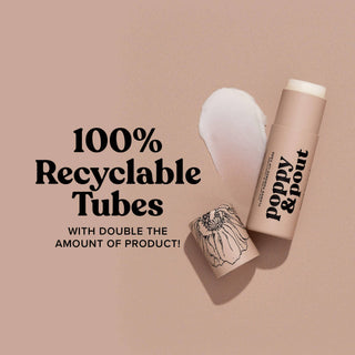 Poppy & Pout lip balm tube with 100% recyclable packaging displayed on pink background with flower illustration