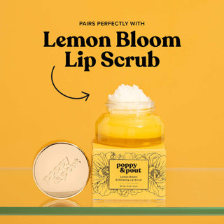 Poppy & Pout Lemon Bloom lip scrub jar with white scrub visible and matching compact on orange background