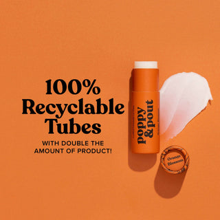 Orange lip balm tube with white cap on orange background promoting 100% recyclable packaging