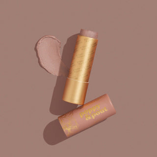 Poppy & Pout Faye lip tint with golden packaging and pink cap, shown with product swatch.