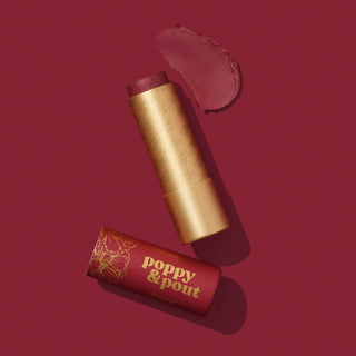 Poppy & Pout lip tint in gold tube with red packaging and product swatch on burgundy background