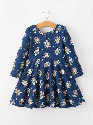 Rylee Faith Designs girls' long sleeve floral print skater dress displayed on a wooden hanger.