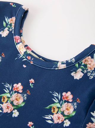 Close-up detail of a floral print girls long sleeve dress neckline by Rylee Faith Designs.