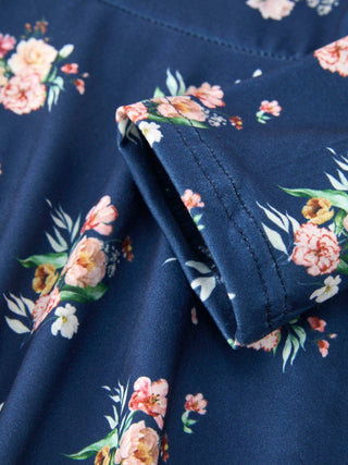 Close-up detail of a floral print girls dress showing fabric texture and stitched pocket.