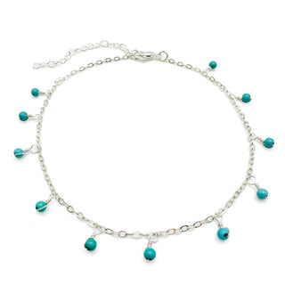 Silver chain anklet with turquoise bead charms and adjustable clasp on white background