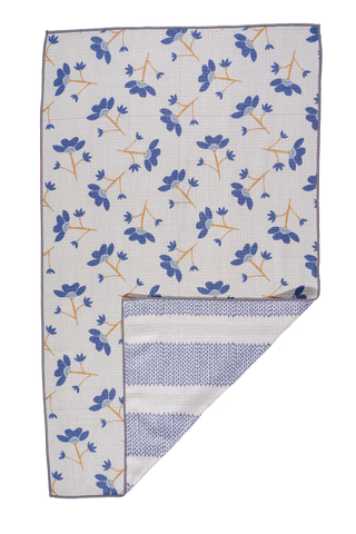 White kitchen towel with blue floral pattern and orange stems, corner folded to show striped reverse side.