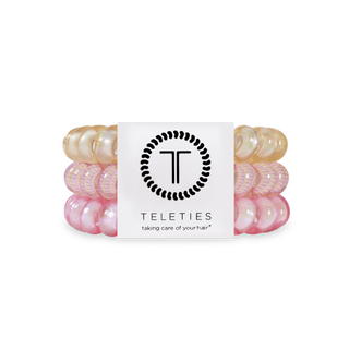 TELETIES hair ties in gradient pink and peach colors displayed with brand logo and packaging