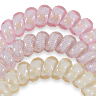 Three translucent hair ties with iridescent shimmer and glitter accents in soft pastel tones